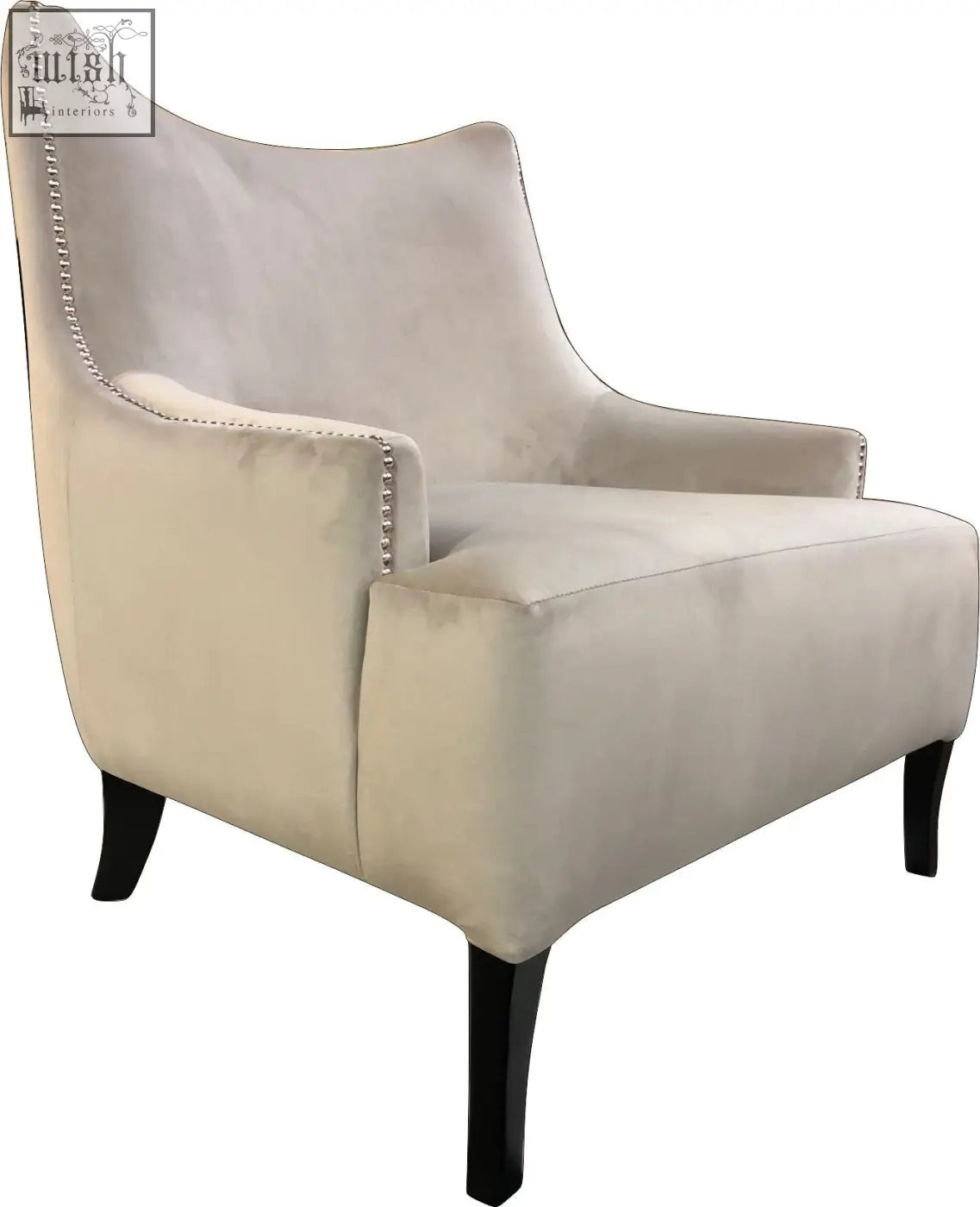 Cream-colored velvet york arm chair with silver nailhead trim and dark wooden legs for stylish seating