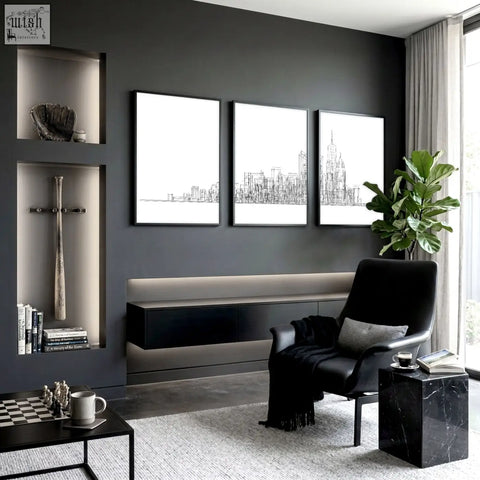 Black leather armchair with gray cushion and black throw blanket next to york posters minimalist skyline wall art for games room
