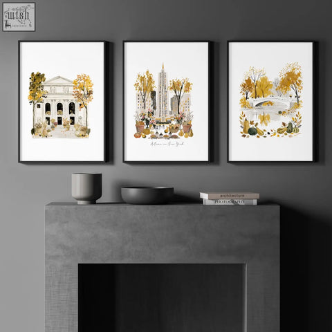 Three black framed york wall art canvas prints with autumn watercolor buildings and parks featuring golden foliage