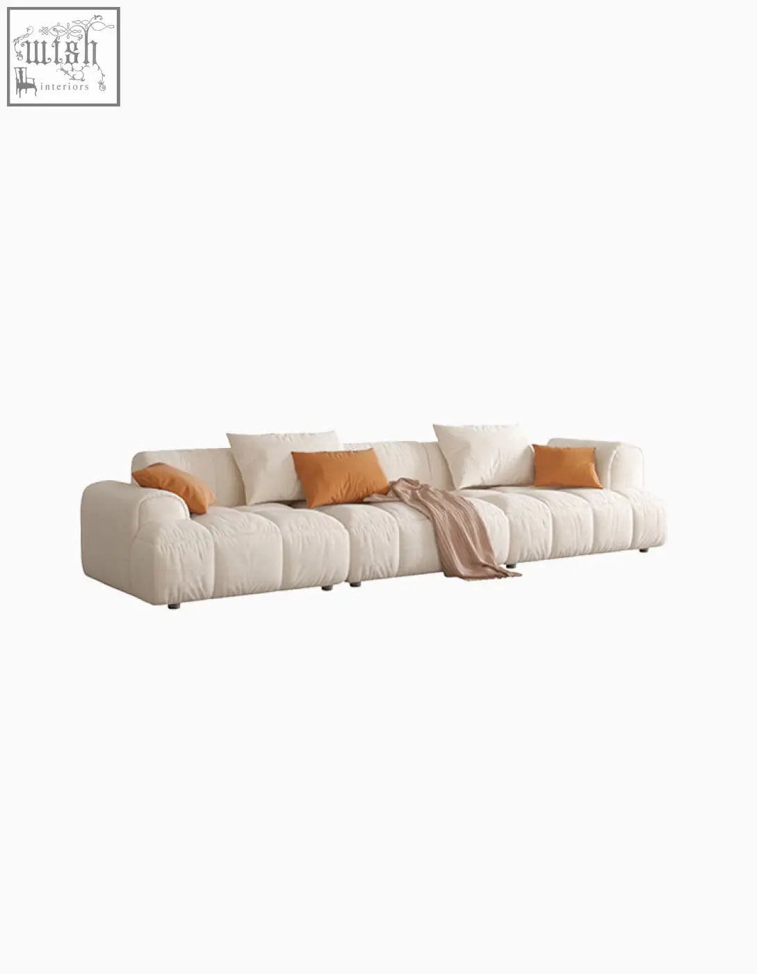 Cream-colored newbury modern three seater sofa with plush velvet cushions and bright orange accent pillows