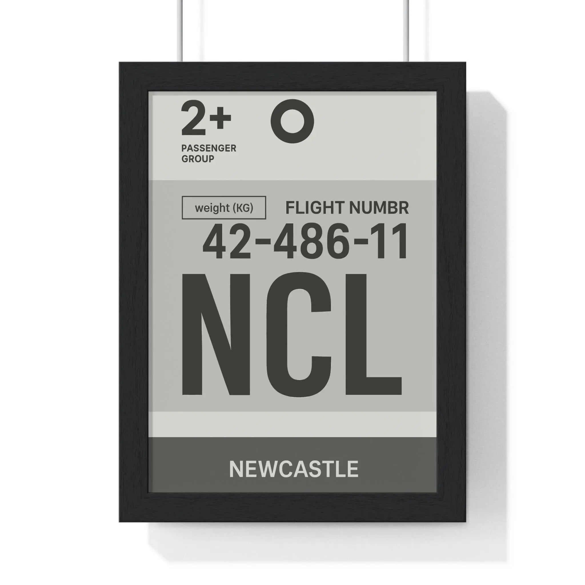 Black-framed airport luggage tag art print with minimalist gray and white newcastle ncl boarding pass design