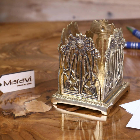 Antique-style brass toast rack with intricate floral vine detailing and central sunflower motif for luxury desk accessories