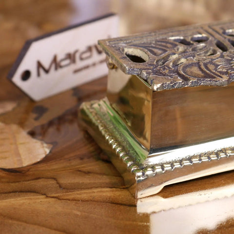 Silver ornate rectangular box with embossed floral patterns and beaded edges for luxury desk accessories