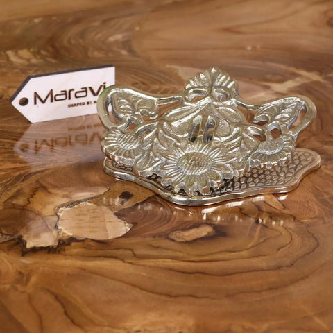 Silver-toned metal napkin holder with sunflower embossing and handle perfect for luxury desk accessories