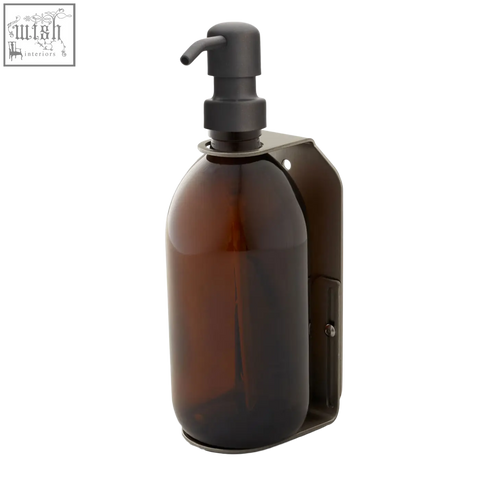Nickel single wall mounted soap dispenser with dark amber glass bottle, matte black pump, and stainless steel bracket