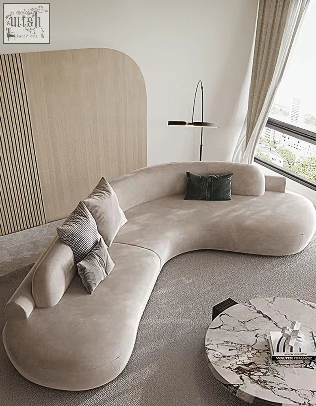 Beige nicosia grey curved three seater sofa with soft velvet upholstery and dark green accent pillows in suede