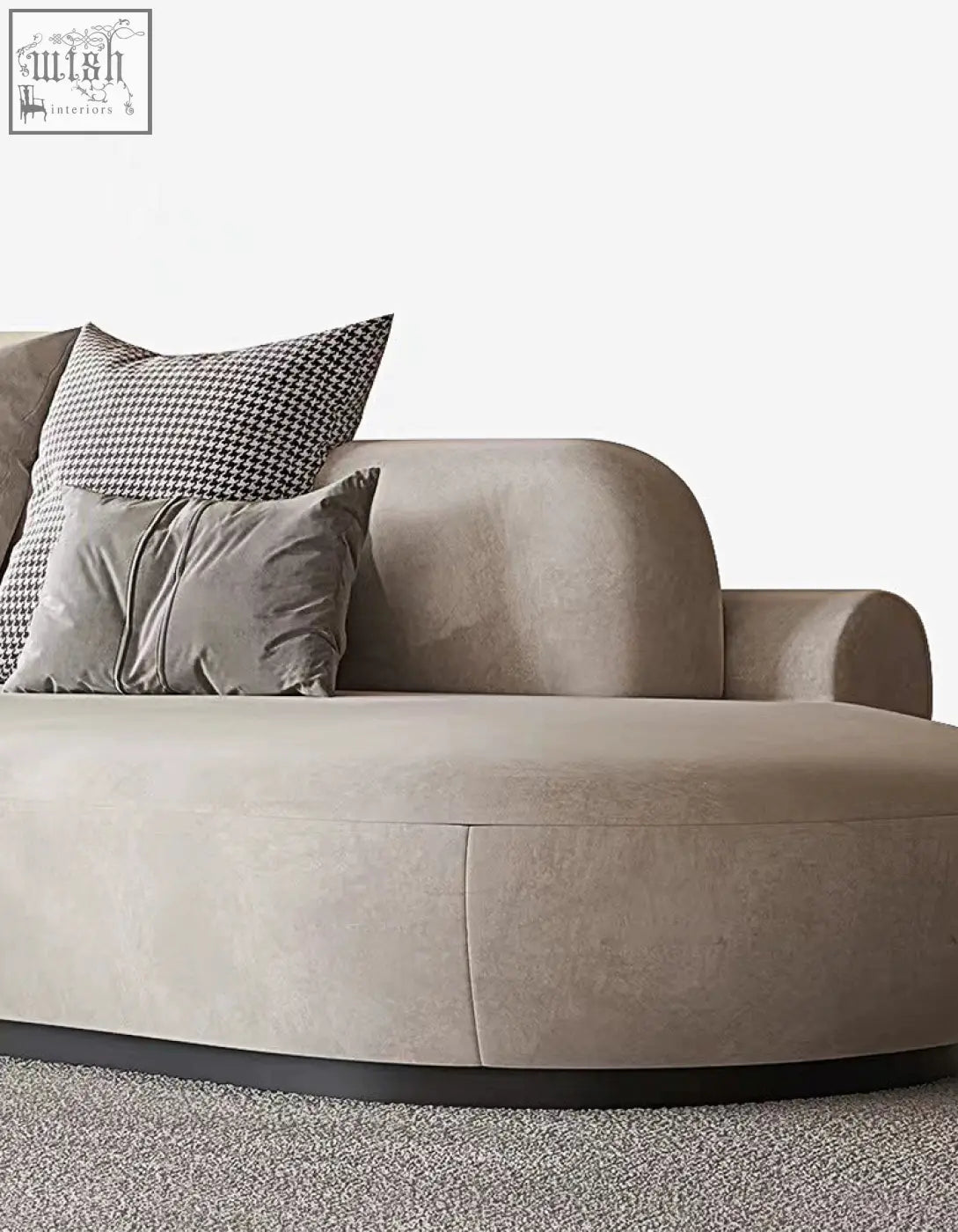 Beige velvet nicosia grey curved three seater sofa with rounded contours and sleek black base in suede