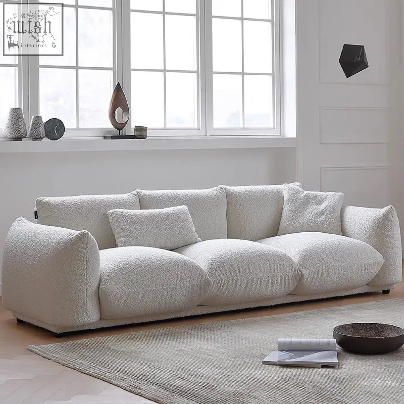 Cream-colored nimbus sofa with plush faux-fur luxurious fabric and contemporary lines for modern living spaces
