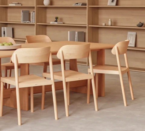 Light wood nimma chair dining chairs with minimalist design and smooth rounded edges for modern spaces