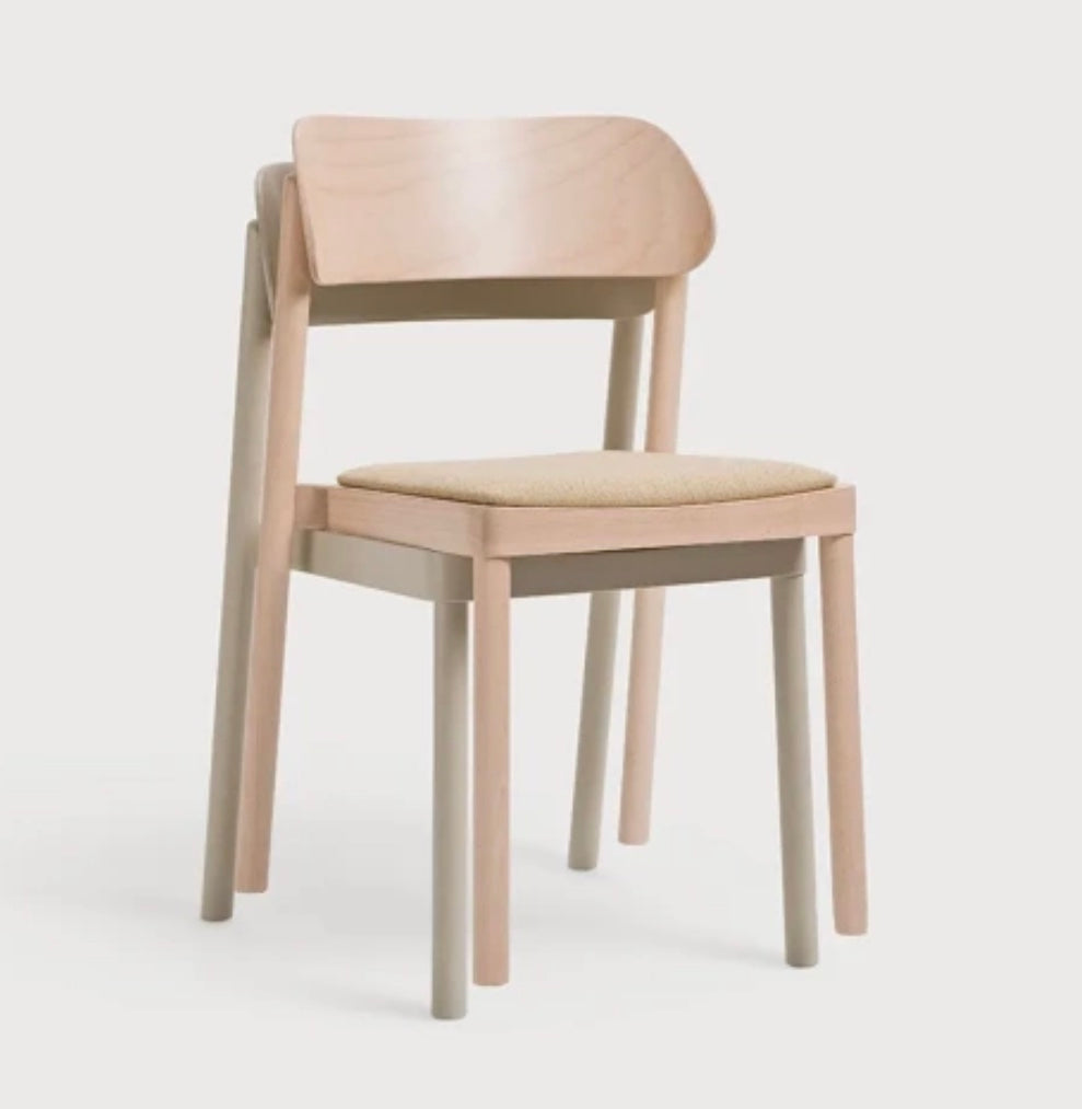 Minimalist nimma chair with light beige upholstered seat and backrest and slender natural wood legs
