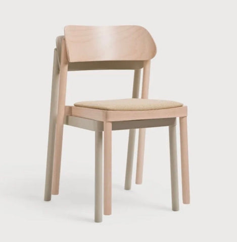 Minimalist nimma chair with light beige upholstered seat and backrest and slender natural wood legs