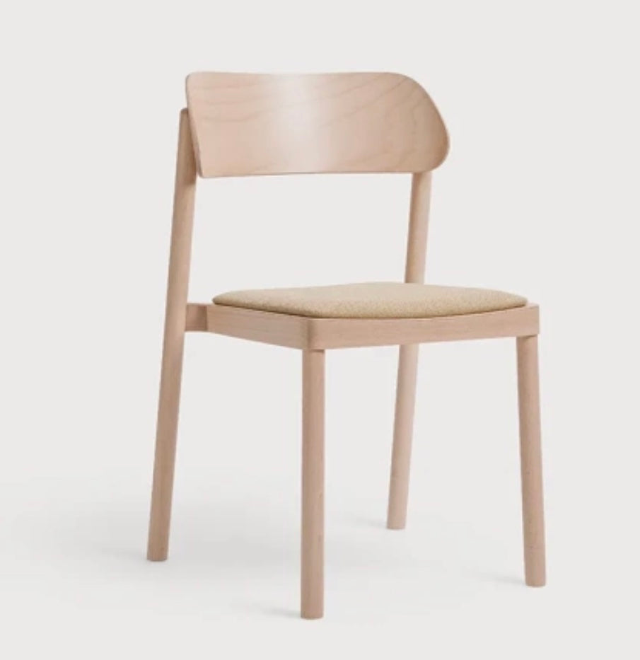 Minimalist wooden nimma chair with light beige upholstered seat and backrest perfect for modern interiors