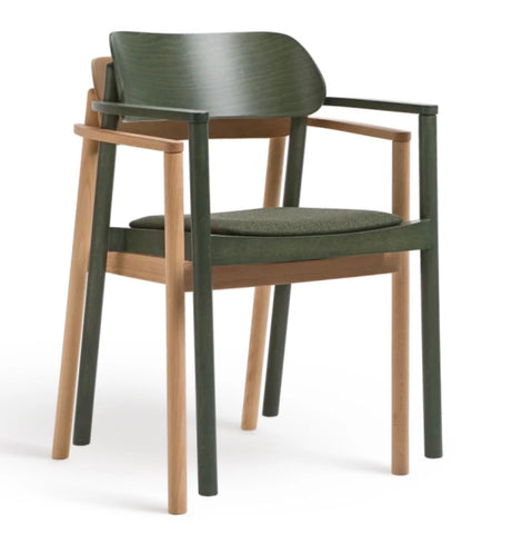 Modern armchair nimma chair with dark green painted frame light wood accents and cushioned seat in matching fabric