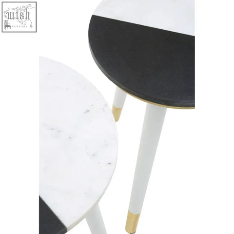 Nirav black and white marble side table with sleek white marble top and acacia wood legs with gold caps