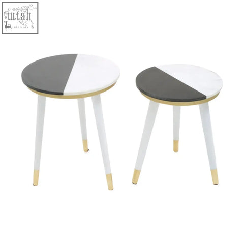 Two minimalist nirav side tables with half white marble tops and slender acacia wood legs tipped in gold
