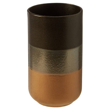 A sleek nixon stoneware vase with a matte black to metallic bronze and warm amber gradient finish