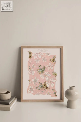 A framed spring romance vintage archive poster print with white green leaves on pink in a light wood frame made from ethically sourced materials