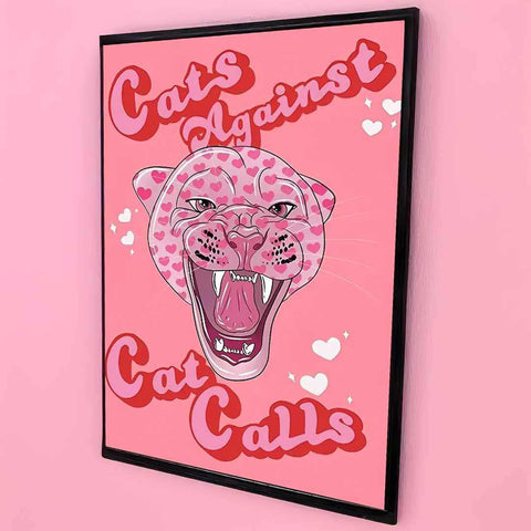 A framed pink print featuring a cartoon leopard with hearts and bold red cats against cat calls text titled no means no