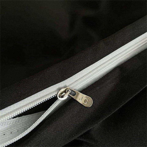 Silver zipper with metallic pull tab on black fabric of noir black bedding set perfect for stylish black bedding