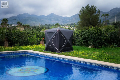 Black inflatable pool tent with diamond shaped front panel and white trim for r14s second tent safety pack use