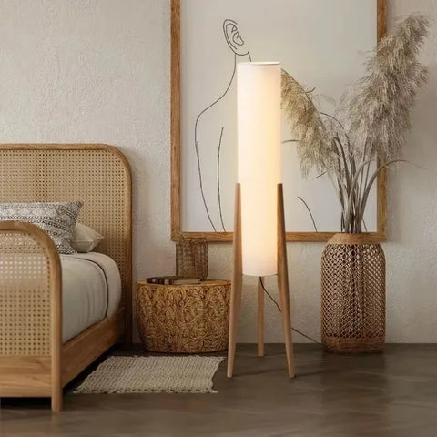 Nordi light tall floor lamp with soft white cylindrical diffuser and slender wooden legs for cozy lighting