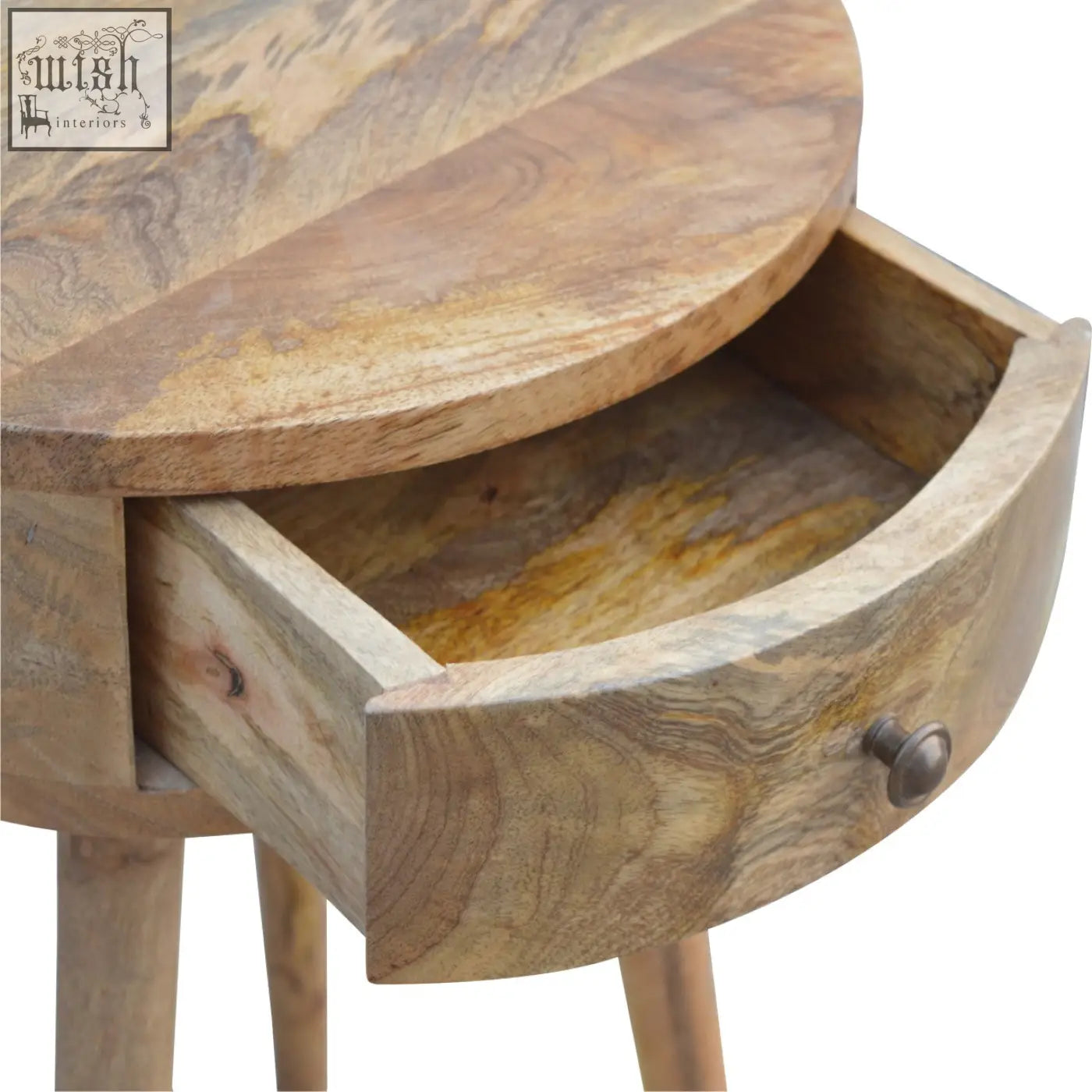 Nordic circular shaped bedside table in natural light brown mango wood with visible wood grain patterns