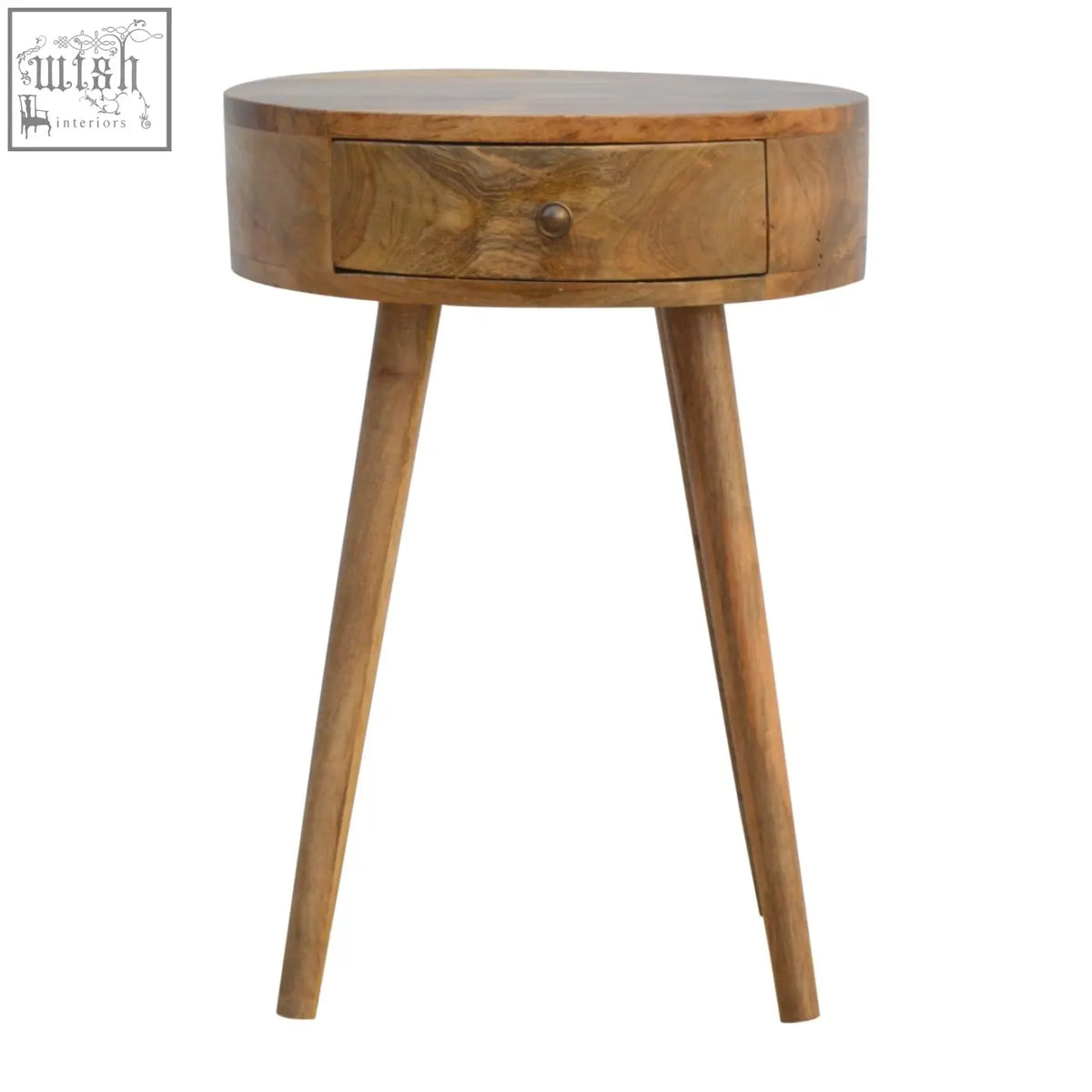 A nordic circular shaped bedside table in oak mango wood with a round top, single drawer, and tapered legs