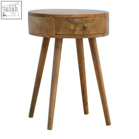 Nordic circular shaped bedside table in oak mango wood with a round top drawer and tapered legs for bedroom use