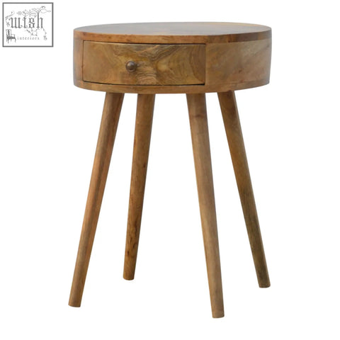 Nordic circular shaped bedside table in oak mango wood with a single drawer and four tapered legs