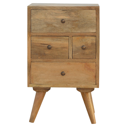 A light wood bedside table with three drawers in oak-ish solid mango wood featuring round metal knobs