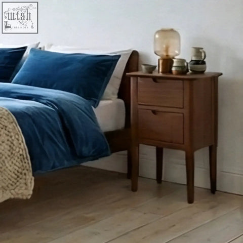 Norway narrow walnut bedside table with two drawers and slender legs in warm wood tone from norway wooden furniture collection