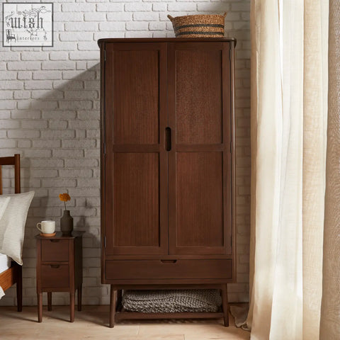Dark brown norway walnut wardrobe with two doors and drawer featuring simple black handles made from white cedar wood