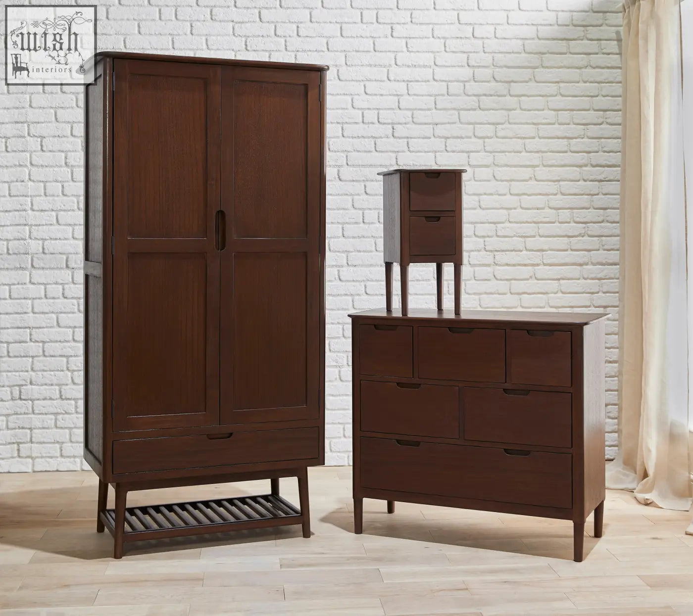 Dark brown norway walnut wardrobe with two doors and lower drawer featuring simple black handles on white cedar wood