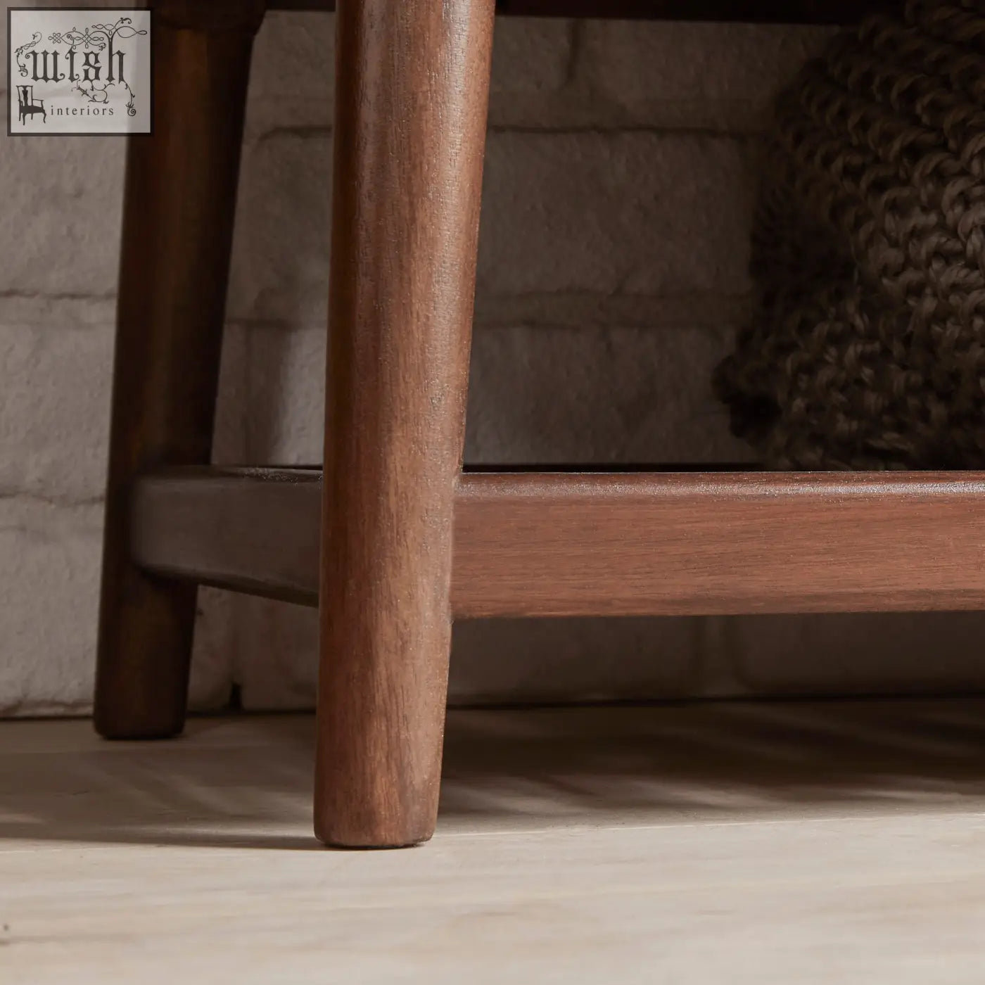 A sleek norway walnut wardrobe side table leg in dark brown with visible grain and smooth finish like white cedar wood