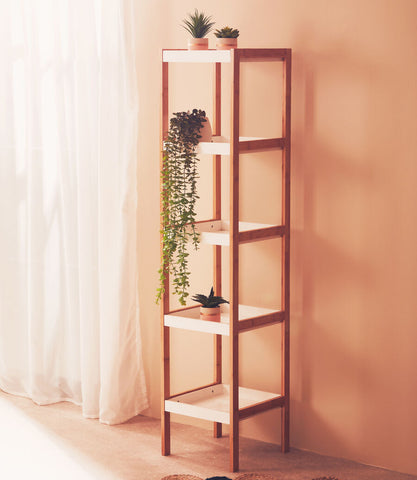 Tall five tiered natural shelf unit with white shelves and small potted plants minimalist design wooden frame