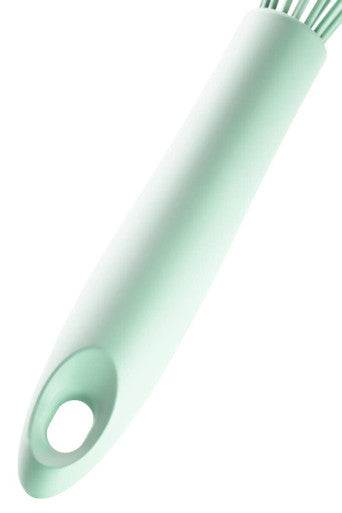 Nova sage green silicone whisk with mint green silicone handle and fine light bristles for easy mixing