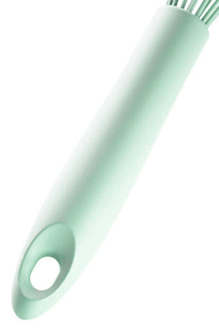 Nova sage green silicone whisk with mint green silicone handle and fine light bristles for easy mixing