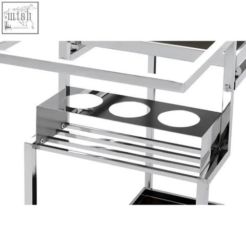 Novo 3 tier trolley with silver finish frame featuring chrome metal and three circular cutouts on the lower shelf