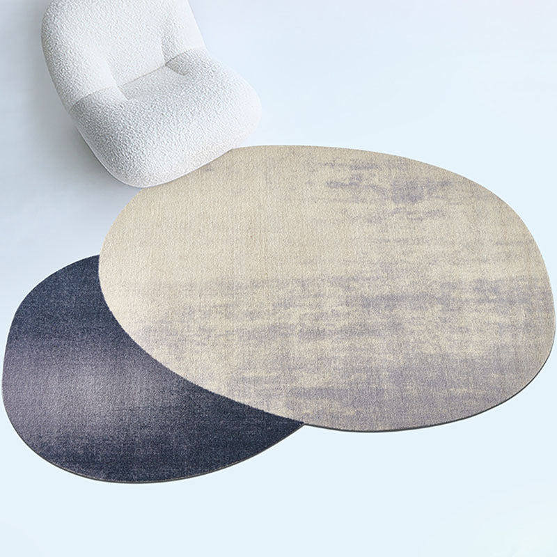 Beige and dark gray oval nulaa fractal wool rug with textured muted finish in various shapes available