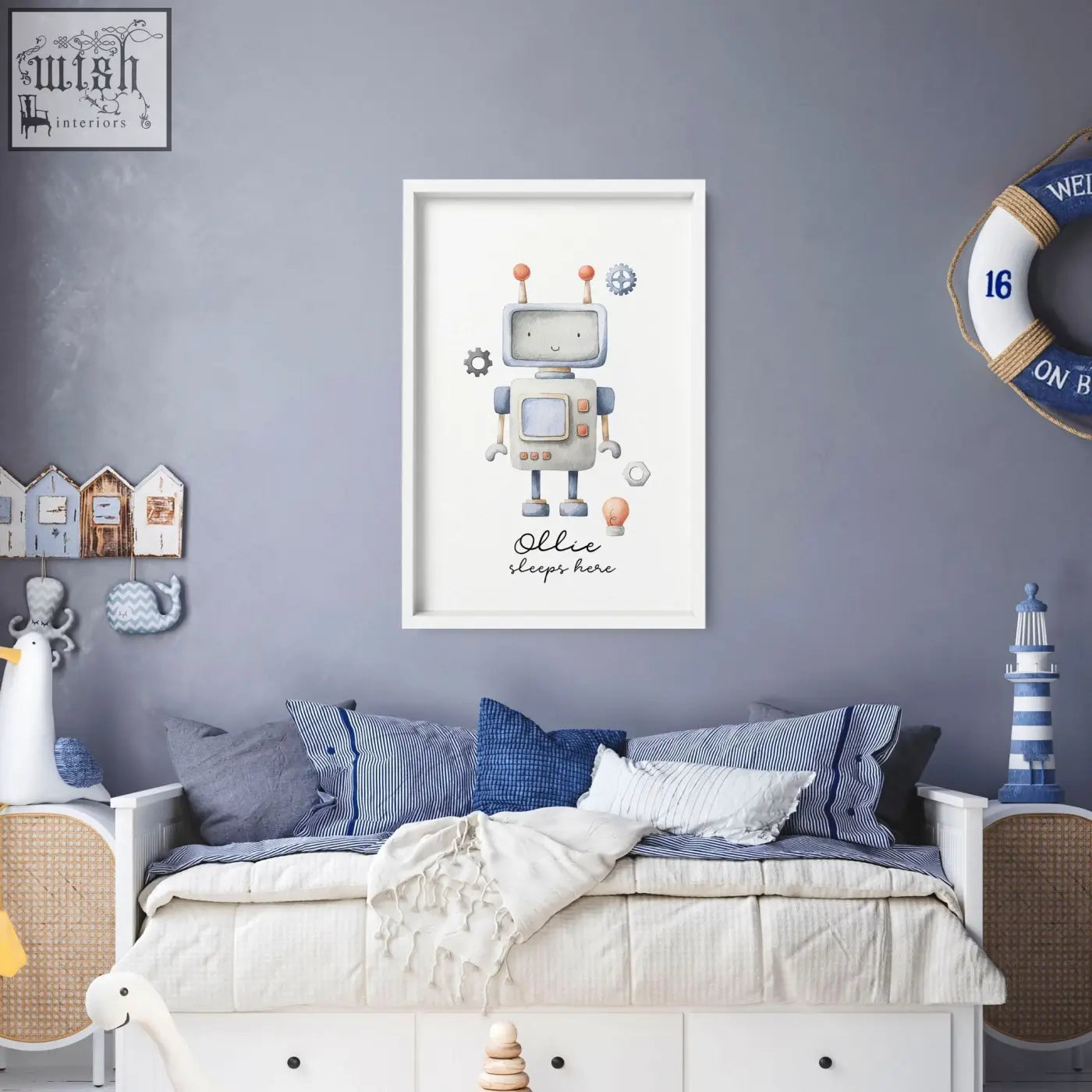 A framed nursery room decor wall art print featuring a friendly gray robot with orange antennae labeled ollie sleeps here