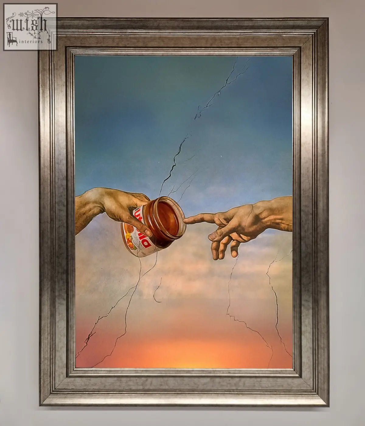 A framed poster showing two hands reaching to touch with nutella jar against cracked sky in a creation framed poster