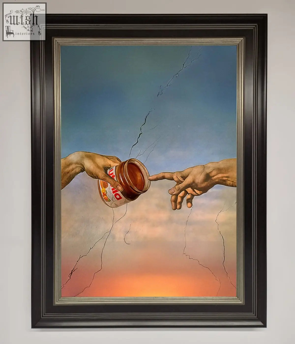 A framed poster showing two hands reaching with one holding a jar of nutella in a creation framed style