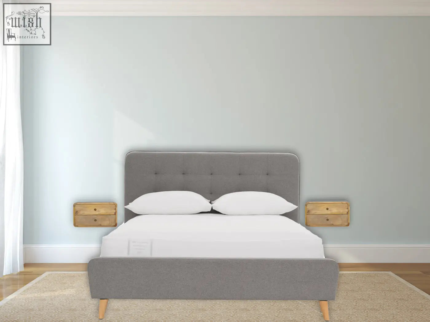 Gray upholstered bed with tufted headboard and wooden legs next to oak-ish 2-drawer floating bedside table wall-mounted
