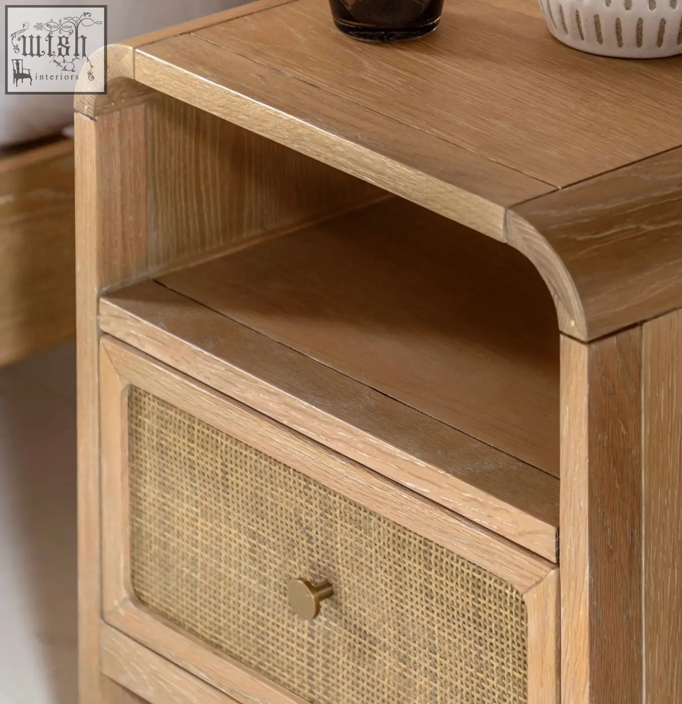Light oak wood oakham bedside cabinet with woven cane drawer front and brass knob bedside cabinet design