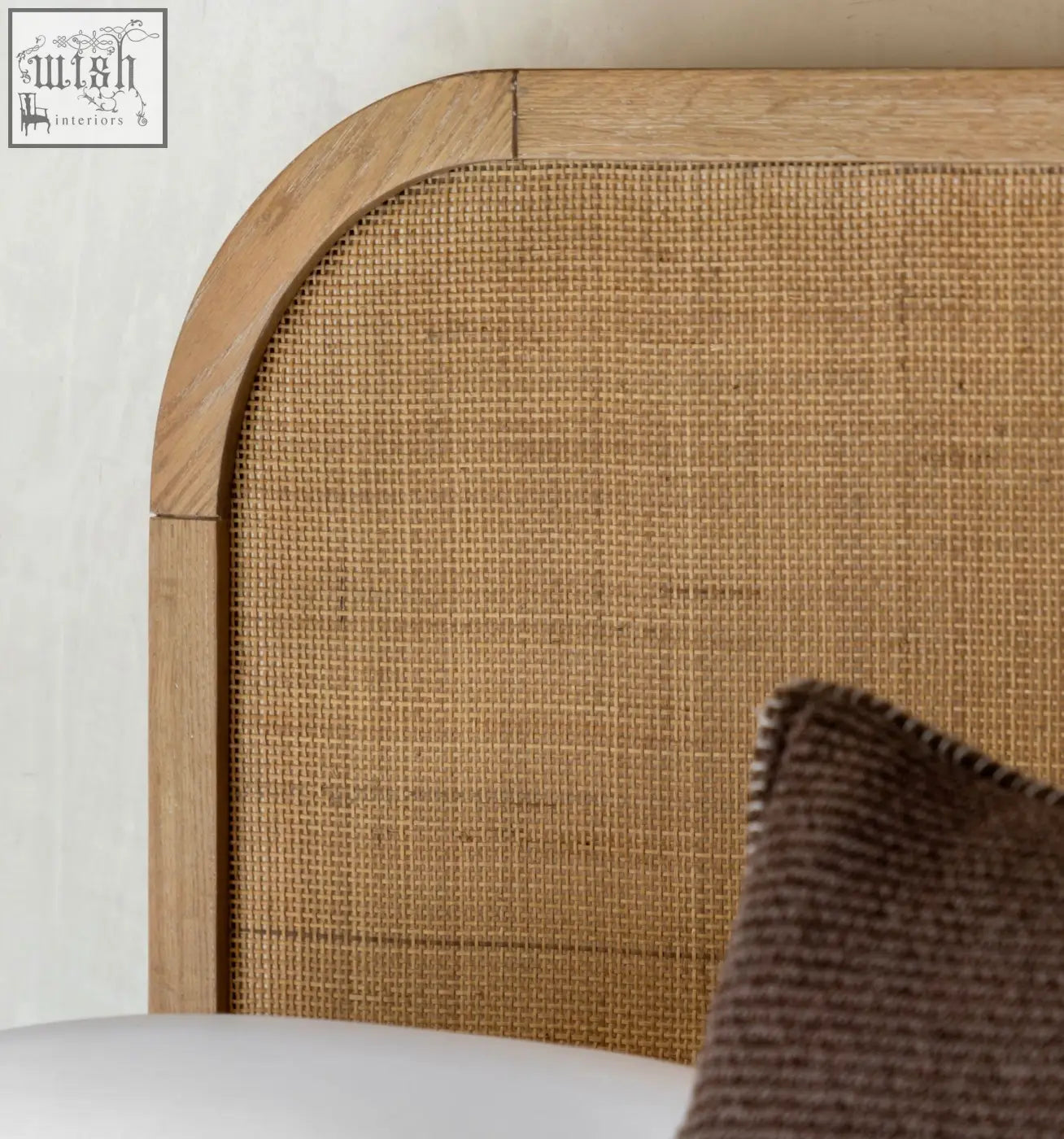 Curved wooden headboard with natural tan cane weave on oak solids oakham double bed frame for a stylish double bed frame