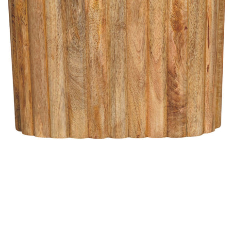 A cylindrical oak-ish marble side table made from solid mango wood with warm rustic finish and vertical wooden planks