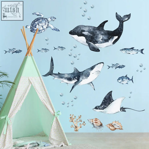 Watercolor ocean predator wall decals featuring orcas great white shark stingrays and turtles in black white gray and blue