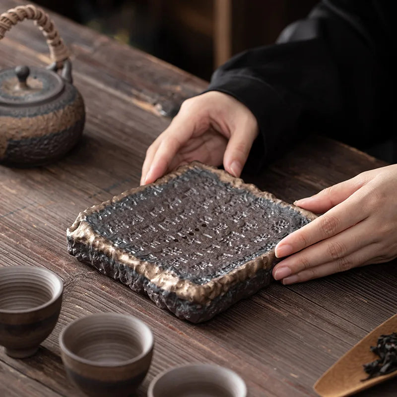 Dark brown ceramic ocha set tea tray with textured uneven edges and a slightly rough surface for serving tea