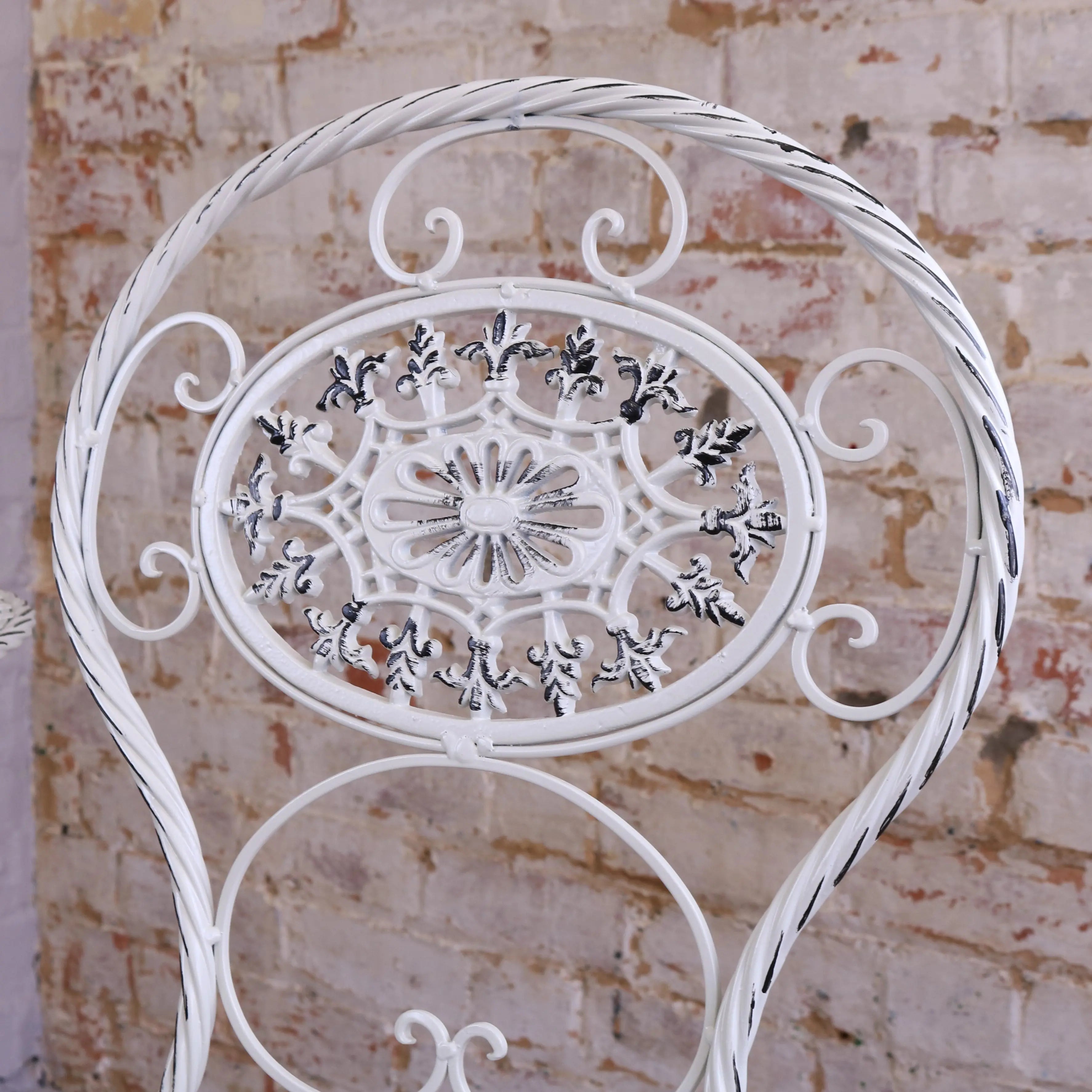 White wrought iron garden chair with floral scrollwork from odal 3 piece oval garden table and chairs set