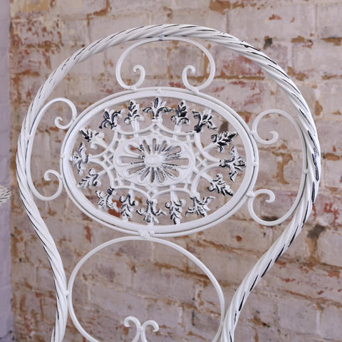 White wrought iron garden chair with floral scrollwork from odal 3 piece oval garden table and chairs set